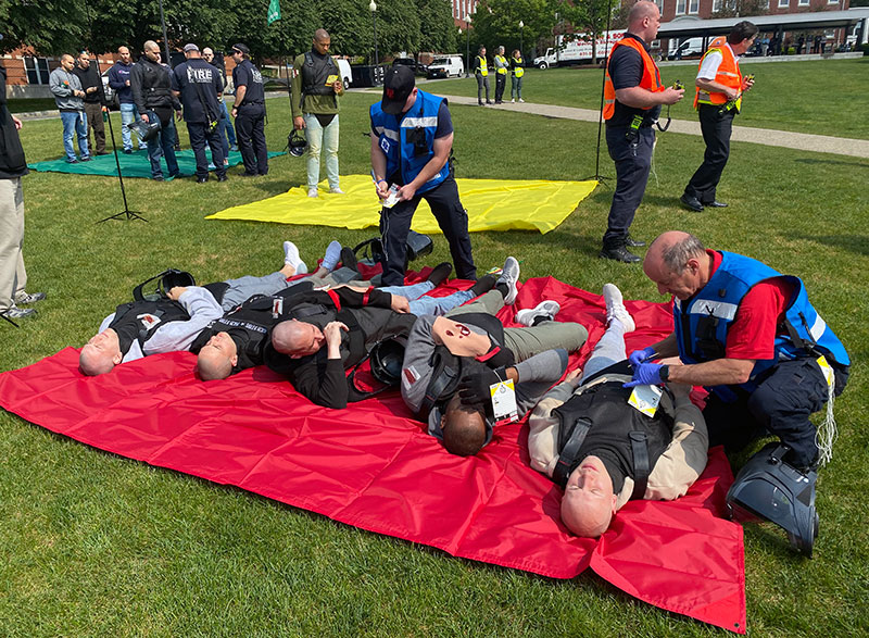 actors playing victims in a shooter drill on campus